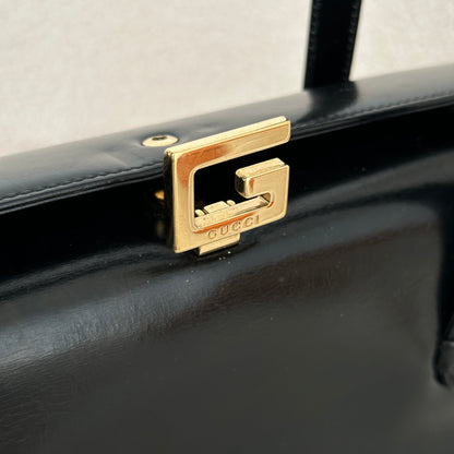 Old Gucci G buckle top handle bag