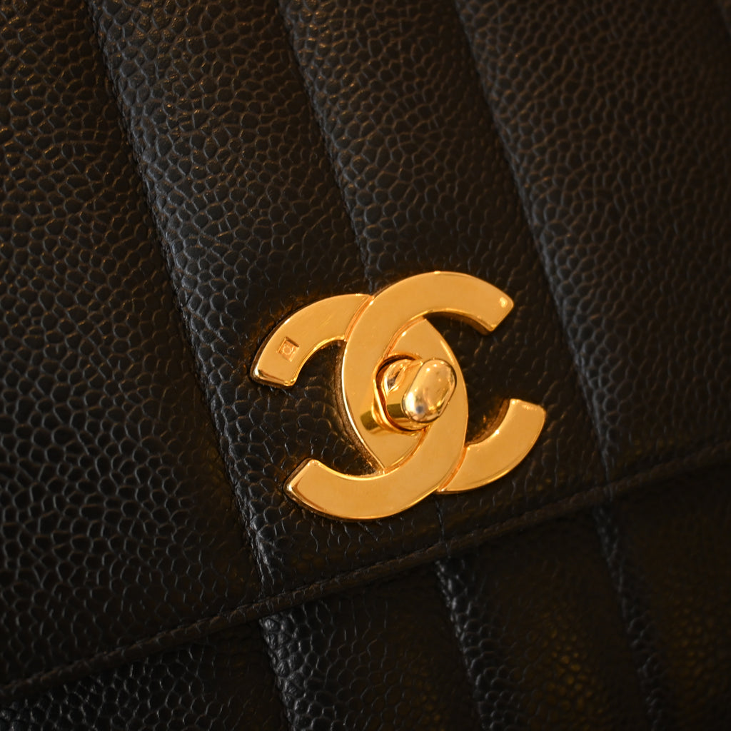 Chanel Black Caviar Vertical Mademoiselle Bag with 24K Gold Plated Hardware