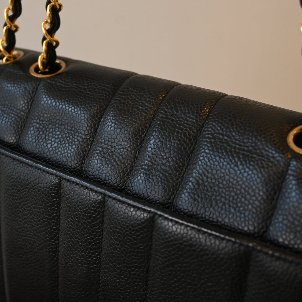 Chanel Black Caviar Vertical Mademoiselle Bag with 24K Gold Plated Hardware