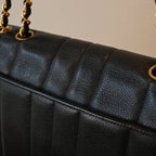 Chanel Black Caviar Vertical Mademoiselle Bag with 24K Gold Plated Hardware