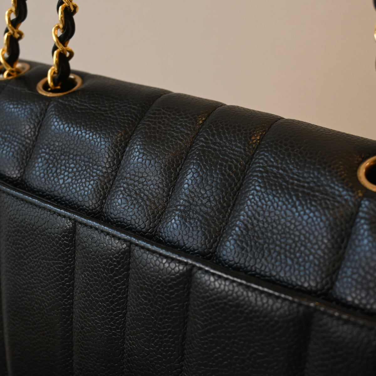Chanel Black Caviar Vertical Mademoiselle Bag with 24K Gold Plated Hardware